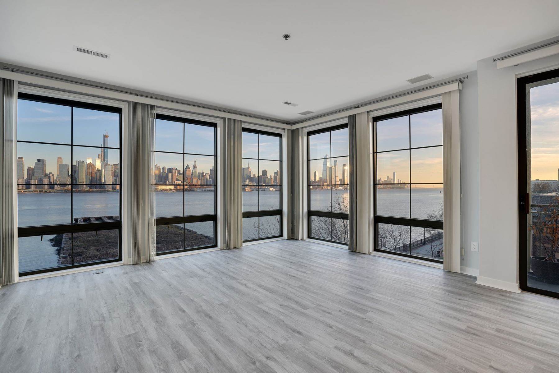 Condominiums for Sale at Enjoy this stunning South East home with NYC and the Hudson River views i 24 Avenue at Port Imperial #303 West New York, New Jersey 07093 United States